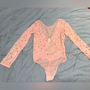 New with Tags Victoria Secret sheer bodysuit with gold tone size large.